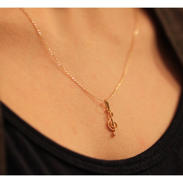 pendentif or clé de sol et diamant