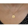 Médaille "l'ange à la colombe" en or jaune 18 carats